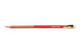 A close-up of a Blackwing Lab 02.22.22 pencil, part natural wood, part red, with red graphite and white eraser
