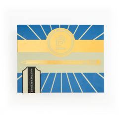 A square box with a geometric art-deco style cover design in blue, yellow, and beige, featuring a pencil illustration and a black spine band labeled 'HALF THE PRESSURE, TWICE THE SPEED.'.
