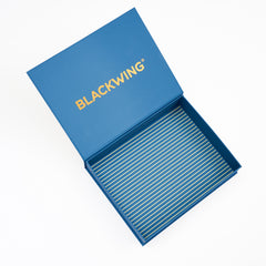 An open blue presentation box with the brand name 'BLACKWING' printed in gold on the inside lid, photographed on a clean white background.