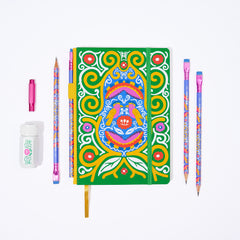 Colorful Frida Kahlo stationery gift set that includes a decorative green, yellow, pink, red, and blue notebook with Frida Kahlo's artwork, several matching patterned pencils, a white sharpener with a floral illustration, and a pink point guard.