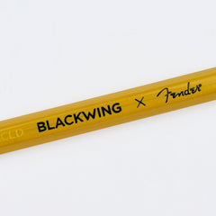 A close-up of a yellow Blackwing x Fender pencil from the butterscotch collection, showing the 'BLACKWING x Fender' branding printed in black, on a clean white background.