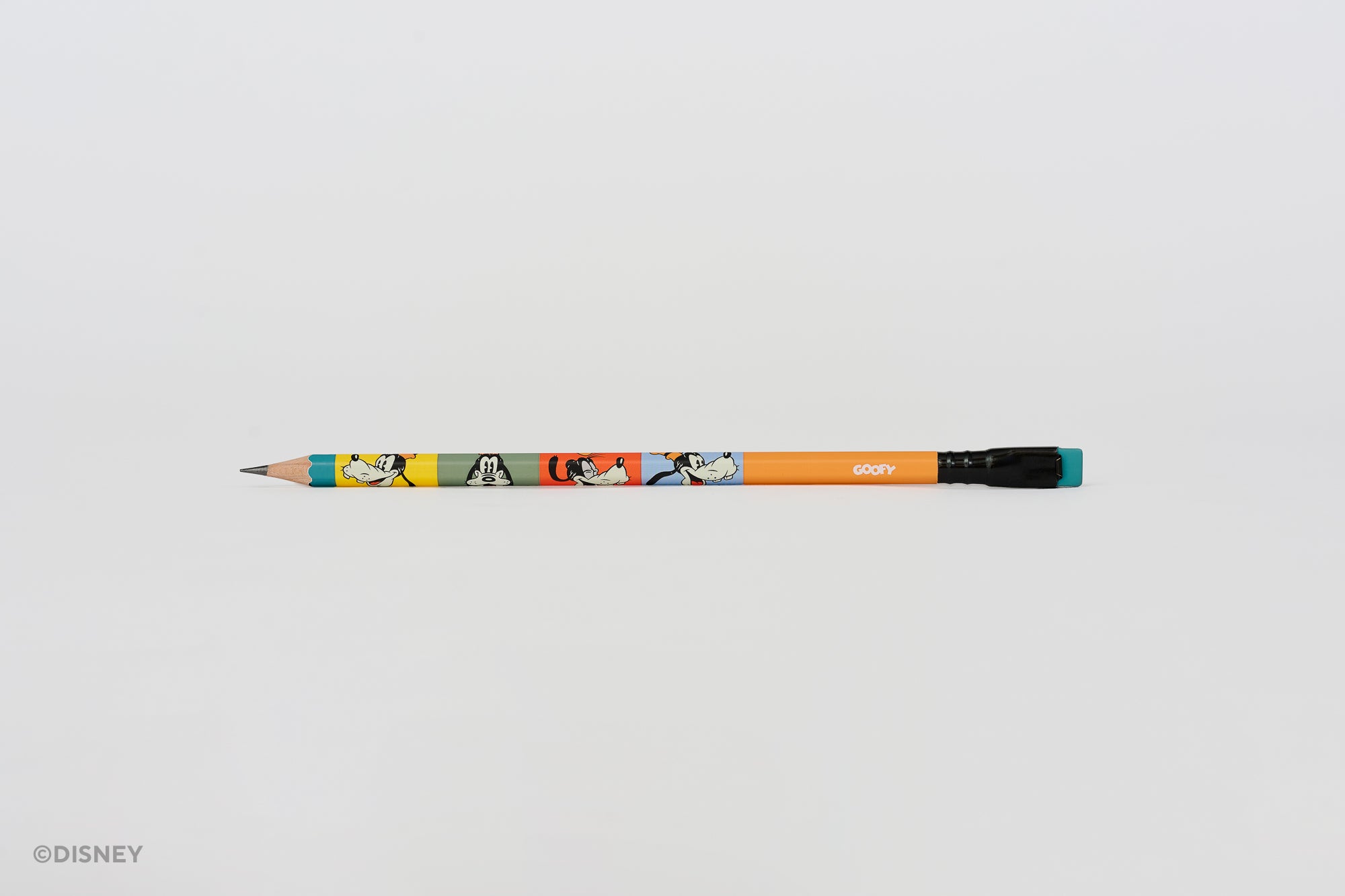 A Blackwing Disney pencil with a colorful cartoon pattern of Goofy on an orange barrel, featuring a black ferrule and a blue eraser, set against a plain light gray background.