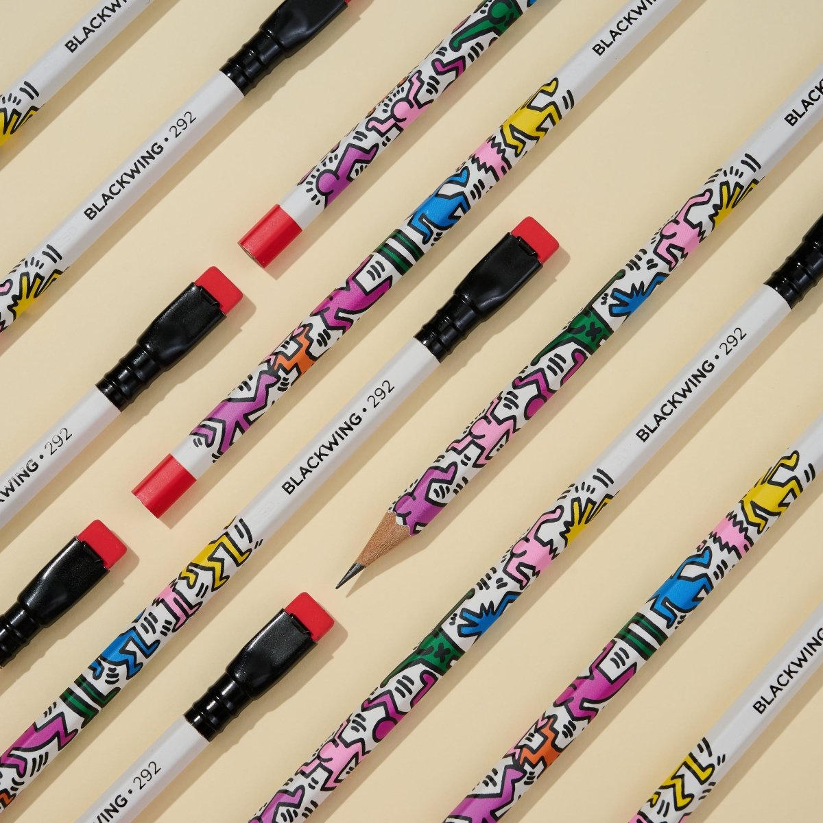 Blackwing Vol. 292 Keith Haring Pencils with dancing illustration at an angle on an off white background