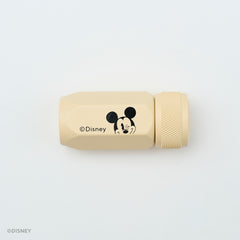 A beige Disney sharpener with a black Mickey Mouse face graphic and the Disney copyright text, shown on a clean white background.