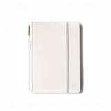 A Medium Blackwing Slate Notebook on a white surface with a Blackwing Matte pencil.